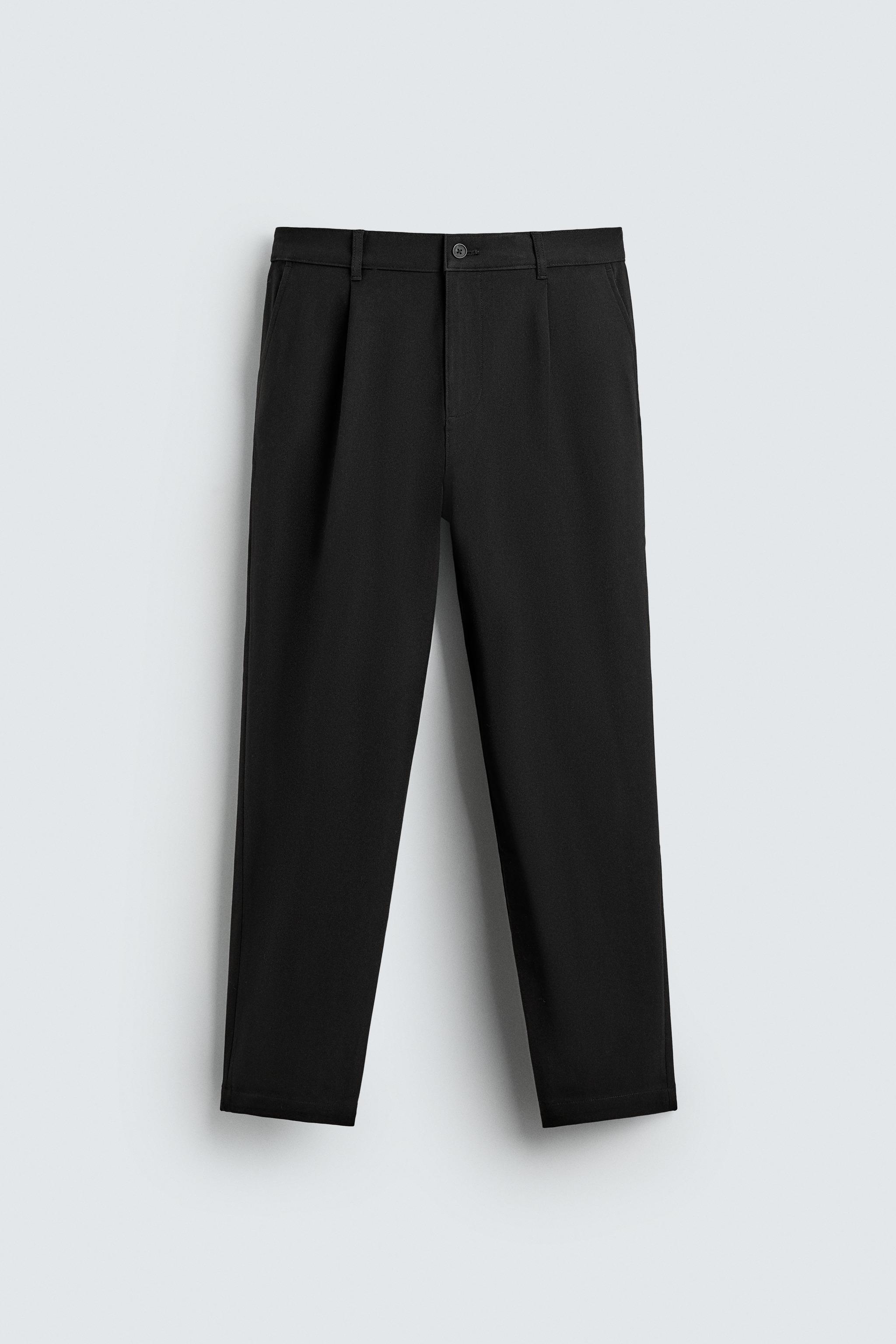 TEXTURED PLEATED PANTS